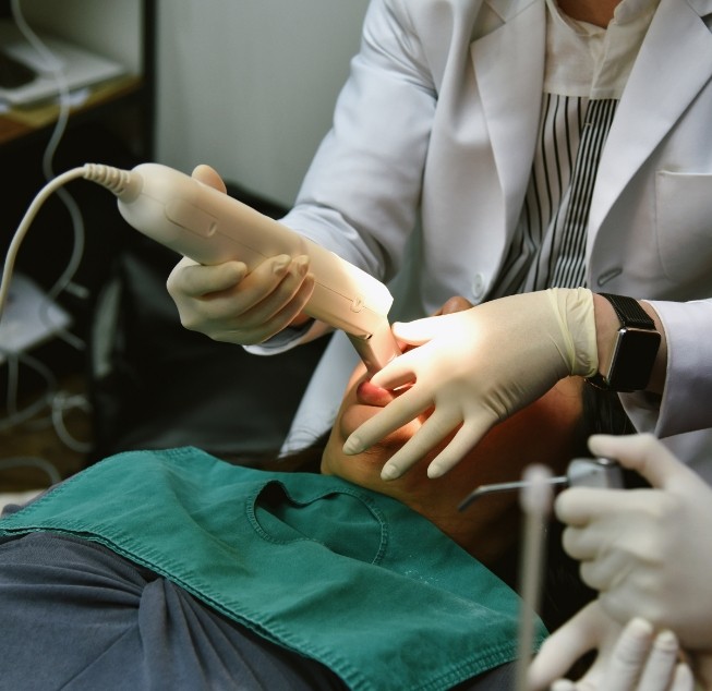 Dental patient having digital impressions of his teeth taken