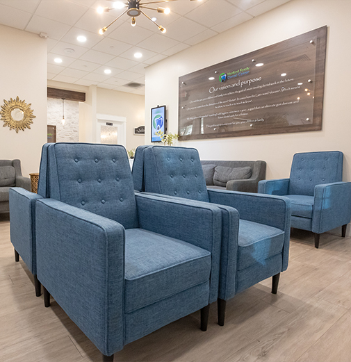 Blue armchairs in waiting area