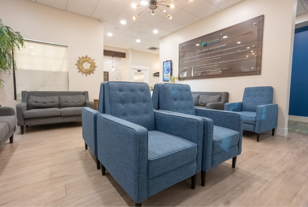 Two blue armchairs in waiting area