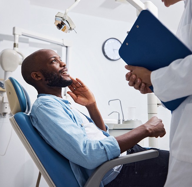 Man smiling at the dentist