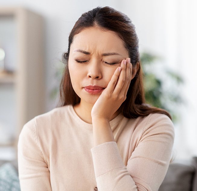 Closeup of woman experiencing tooth pain