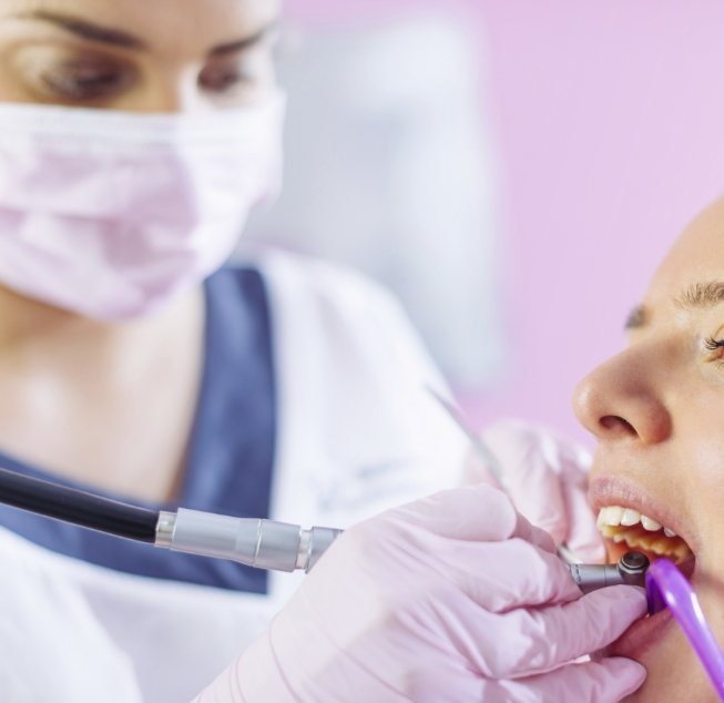 Dentist giving a patient a dental exam