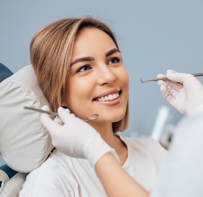 Woman smiling at a preventive dentistry checkup in Hanford